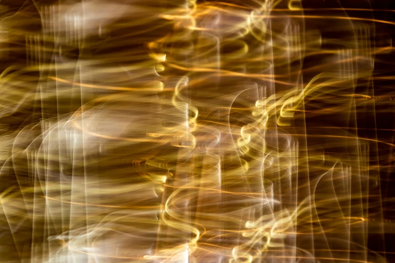 a blurry image of a fire hydrant, a microscopic photo, inspired by Bruce Munro, pexels, lyrical abstraction, gold silk, illuminated lines, gold and white, 1 0 2 4 farben abstract