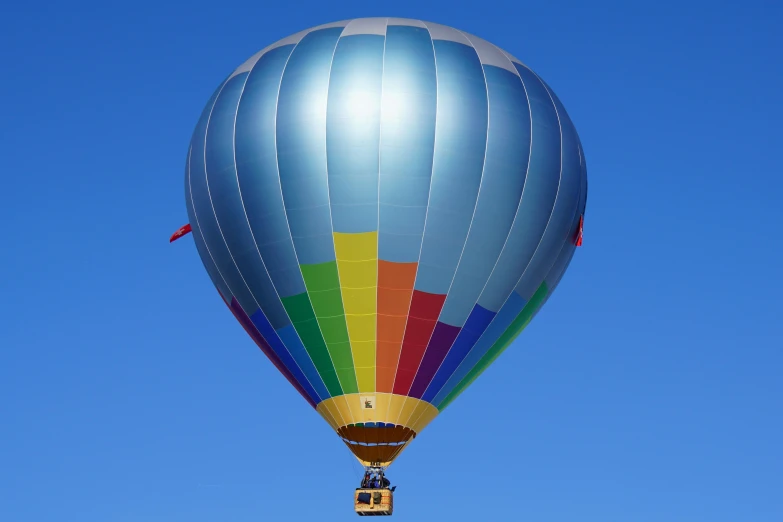 a colorful hot air balloon flying through a blue sky, by Dave Allsop, pexels contest winner, avatar image, clear blue sky, profile image, 15081959 21121991 01012000 4k