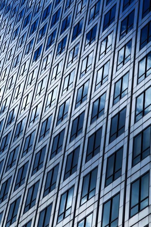 a very tall building with lots of windows, by Doug Ohlson, unsplash, silver and blue color schemes, patterned, square, thumbnail