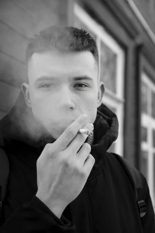 a man smoking a cigarette in front of a building, charli bowater, artem, headshot profile picture, yung lean