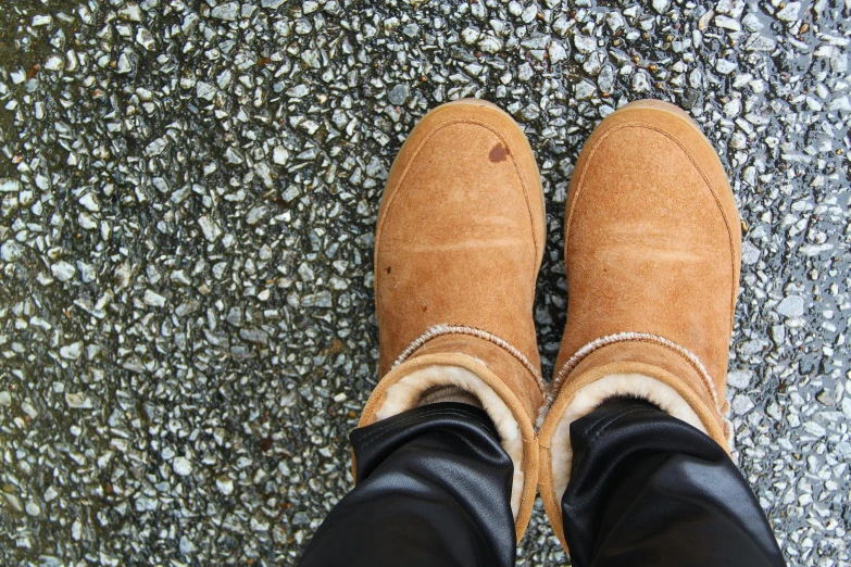 a close up of a person wearing brown shoes, by Carey Morris, trending on pexels, cold as ice! 🧊, new zealand, round thighs, in 2 0 1 5