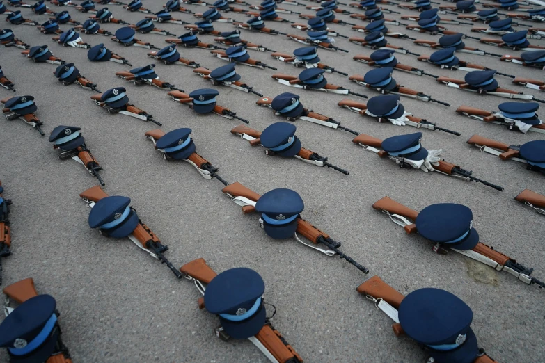 a lot of guns that are laying on the ground, by Boris Vladimirski, reddit, in uniform, beautifully symmetrical, afp, parade