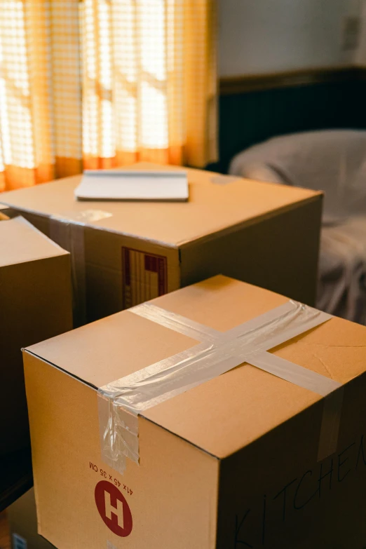 a couple of boxes sitting on top of a table, hotel room, in house