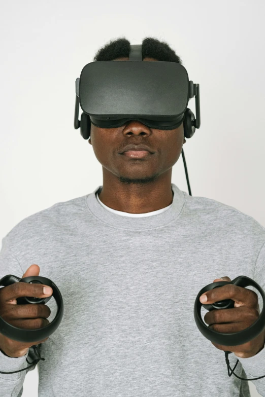 a man wearing a pair of virtual reality headsets, by Carey Morris, afrofuturism, hands straight down, wearing a gaming headset, centered shoulders up view, or black