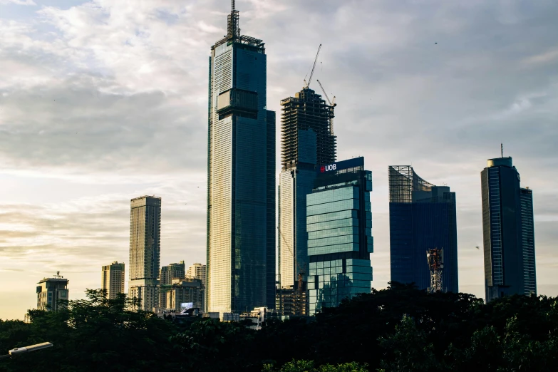 a view of a city with a lot of tall buildings, unsplash contest winner, hurufiyya, under construction, sri lanka, 2000s photo, fan favorite