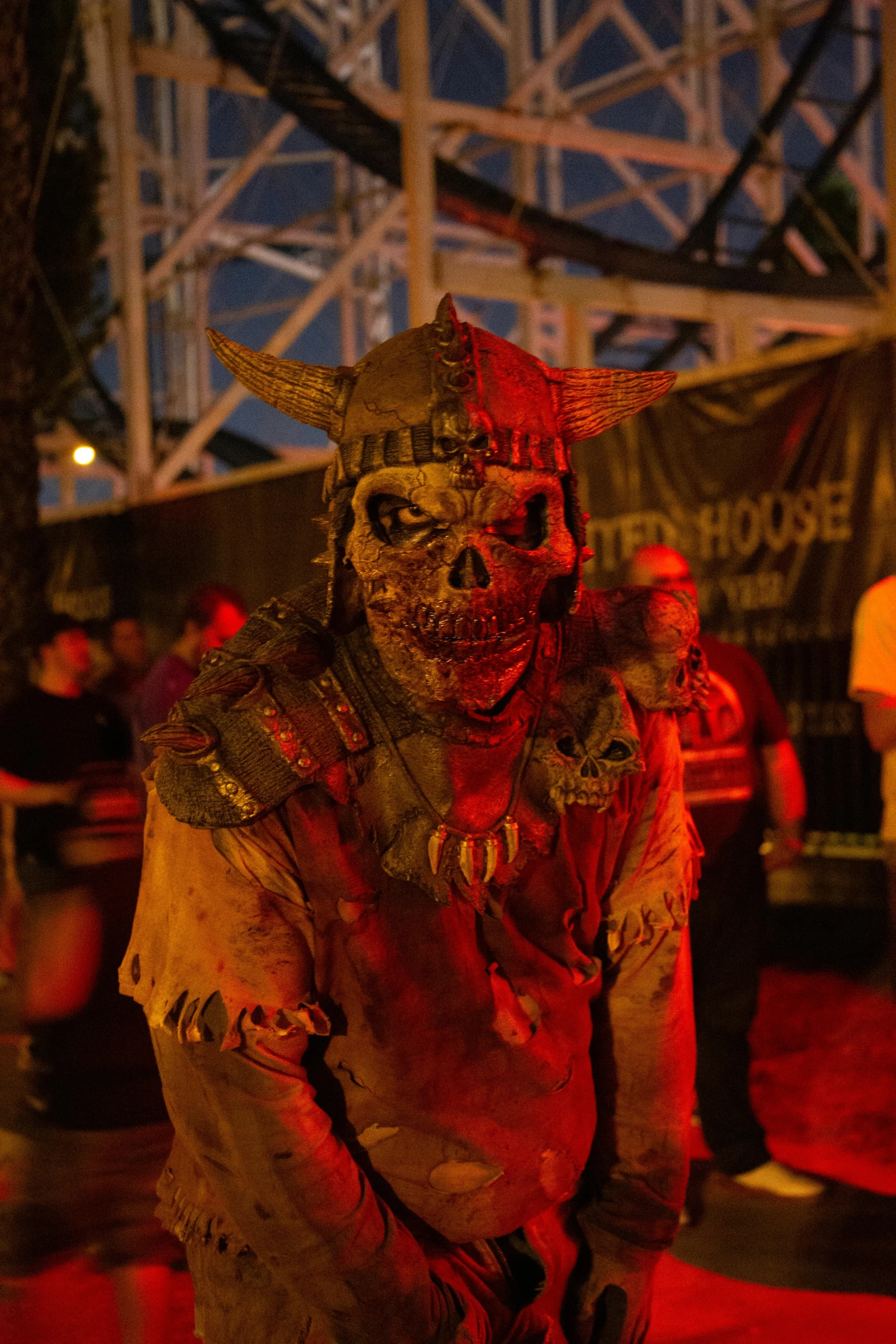 a man dressed up in a zombie costume, by Jason Felix, happening, haunted house themed, heavy metal concert, dusk setting, khorne