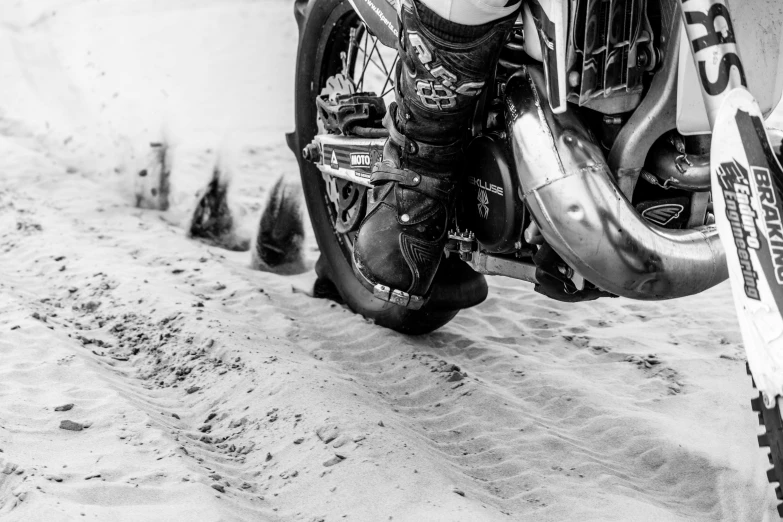 a black and white photo of a motorcycle, unsplash, red shell. dirt track, riding boots, ice dust, tournament