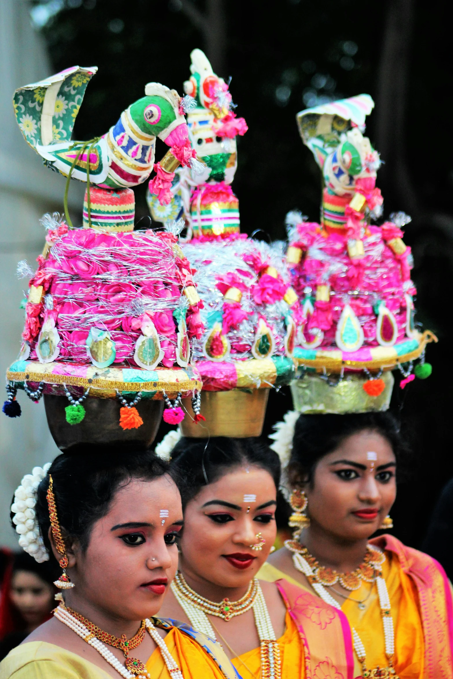 a group of women standing next to each other, bengal school of art, flower sepals forming helmet, festival of rich colors, platforms, closeup - view