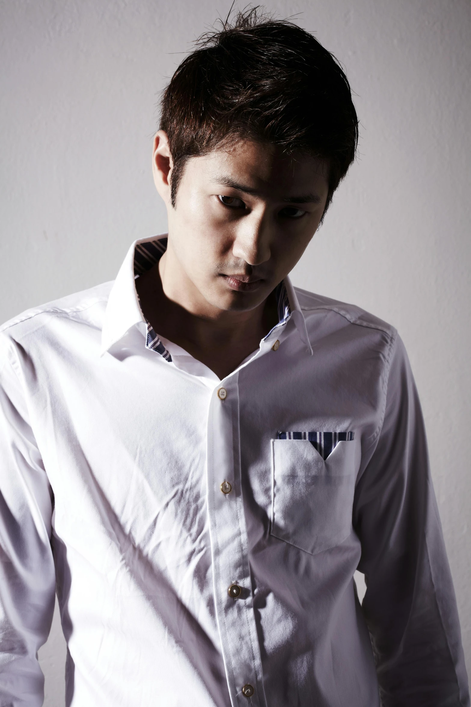 a man in a white shirt posing for a picture, an album cover, flickr, shin hanga, profile shot, high quality upload, kimi takemura, modelling