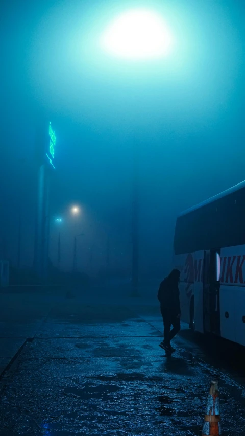 a bus driving down a street on a foggy night, an album cover, inspired by Simon Stålenhag, pexels contest winner, conceptual art, “gas station photography, cyan, cold color, moist foggy