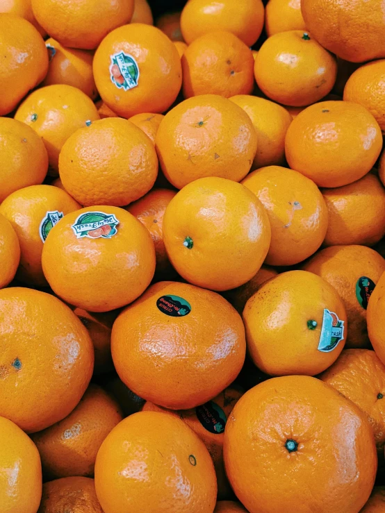 a pile of oranges sitting on top of each other, profile image, highly upvoted, orange safety labels, bells