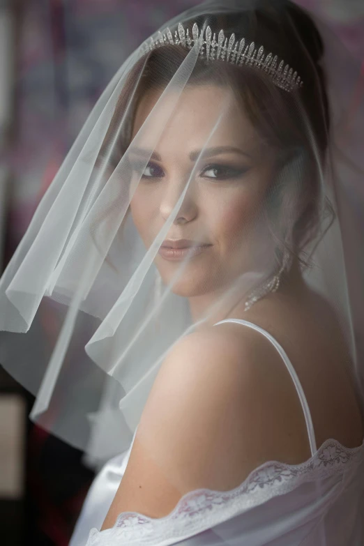 a woman in a wedding dress with a veil over her head, portrait imagery, product shot, haze over the shoulder shot, close-up shoot