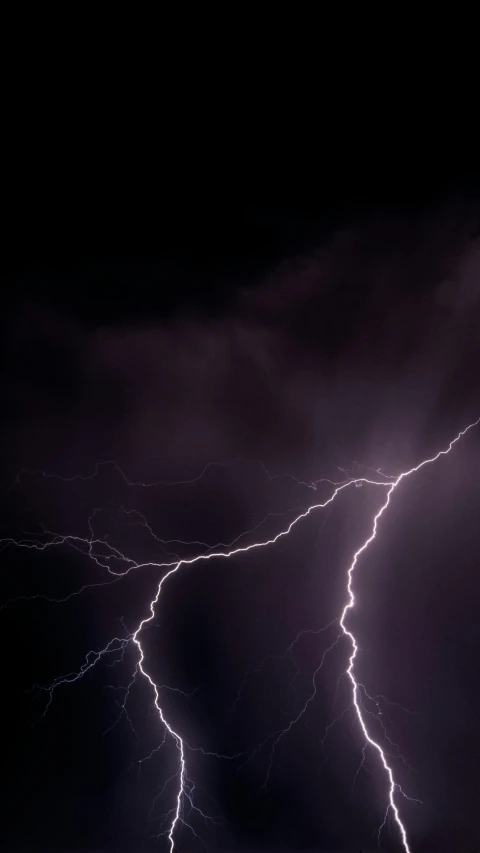 a lightning bolt hitting through a dark sky, pexels, incoherents, getty images, low - angle shot, electricity archs, may 1 0