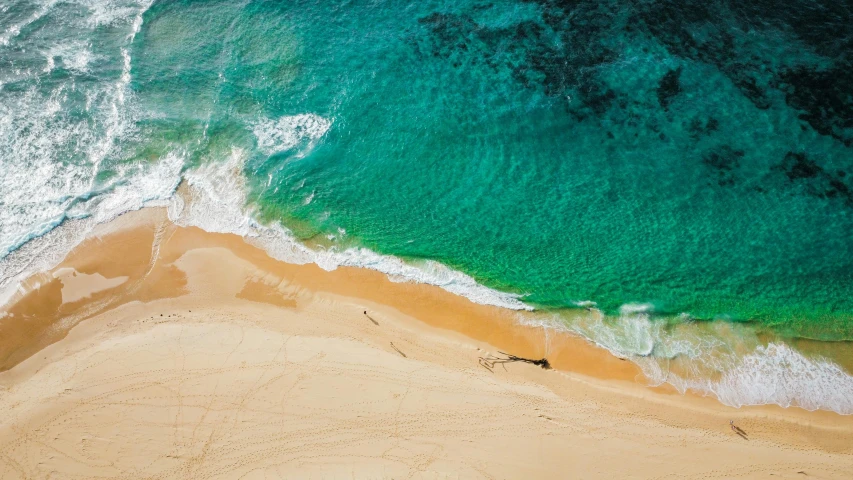 a large body of water next to a sandy beach, pexels contest winner, bird's eye, fan favorite, clean 4 k, manly