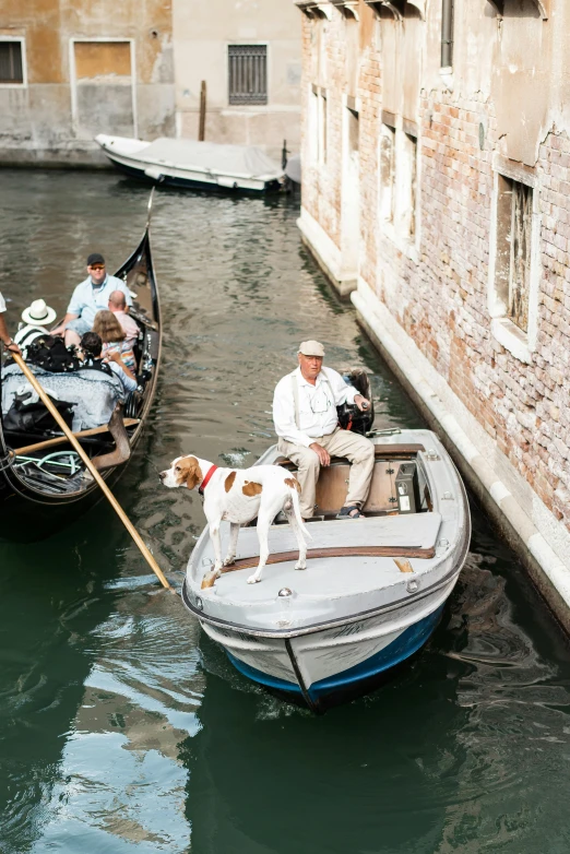 a group of people riding on top of a boat, by Carlo Martini, visual art, with dogs, canals, as photograph, 2022 photograph