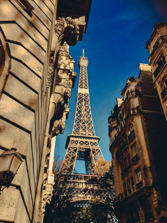 the eiffel tower towering over the city of paris, pexels contest winner, art nouveau, 1999 photograph, square, french village exterior, slide show