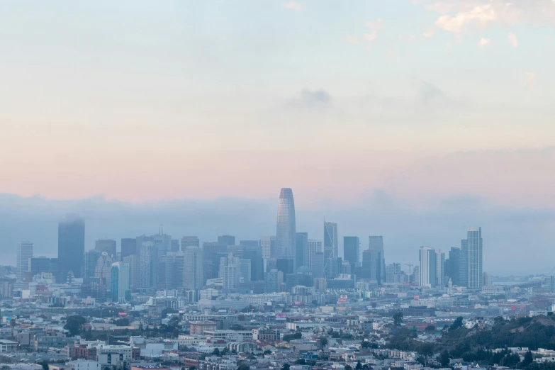 a view of a city from the top of a hill, by Ryan Pancoast, trending on unsplash, sf, background image, slight haze, ignant