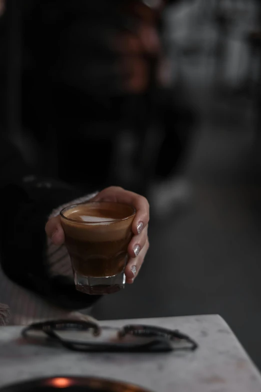 a close up of a person holding a cup of coffee, alessio albi, medium format, cafe racer, iced latte