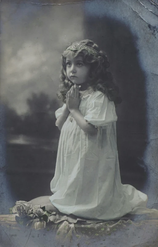 a black and white photo of a little girl, a colorized photo, pexels, pre-raphaelitism, praying posture, advertising photograph, dressed in white, young women