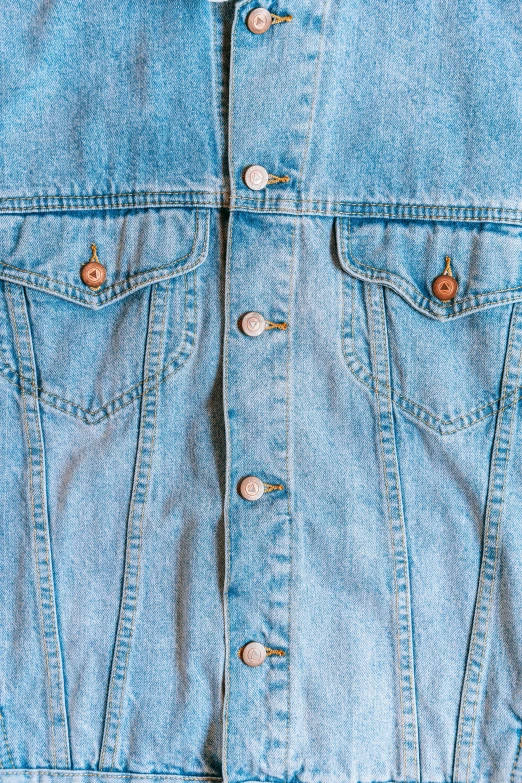 a close up of a jean jacket on a mannequin mannequin mannequin mannequin mannequin mannequin mann, an album cover, inspired by Elsa Bleda, trending on pexels, top down view, highly detailed panel cuts, taken in the early 1990s, symmetrical detail