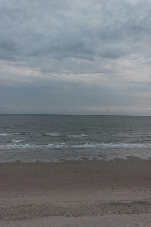 a man flying a kite on top of a sandy beach, inspired by Hendrik Willem Mesdag, hurufiyya, overcast!!!, lê long, mermaids in distance, panorama