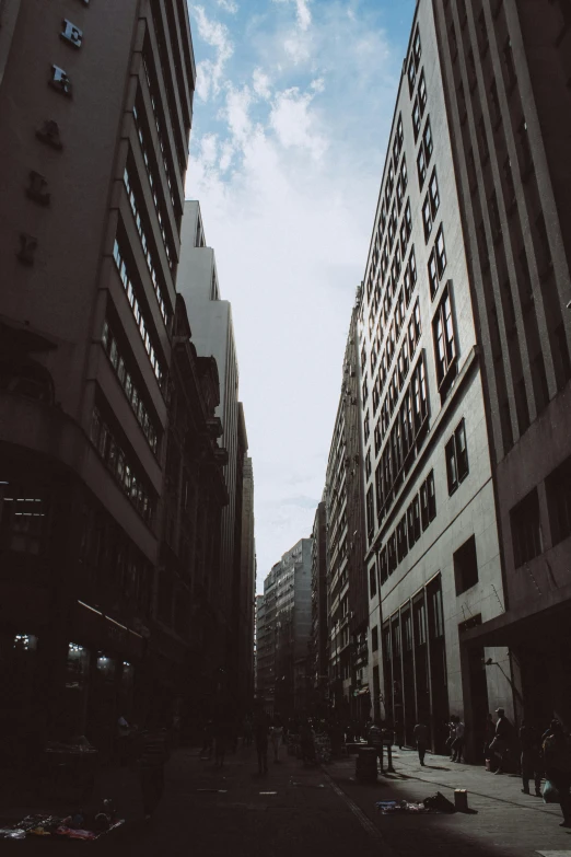 a black and white photo of a city street, a picture, unsplash, modernism, futuristic sao paulo, alley, low angle facing sky, analog photo