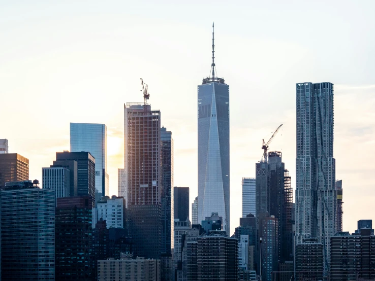 a large body of water with tall buildings in the background, by William Berra, pexels contest winner, modernism, world trade center twin towers, taken at golden hour, bjarke ingels, 2 0 2 2 photo