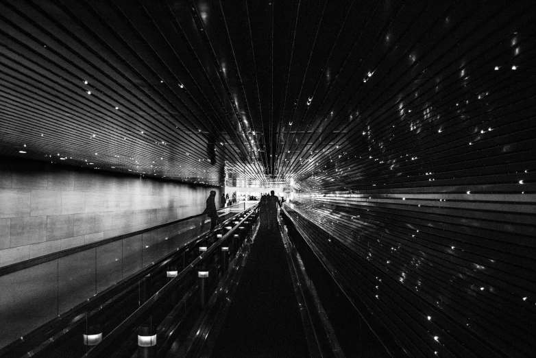 a black and white photo of a subway station, by Ryoji Ikeda, unsplash contest winner, light and space, refracted lines and sparkles, photo on iphone, cinematic. by leng jun, alessio albi