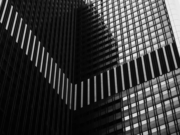 a black and white photo of a tall building, by Sven Erixson, pexels contest winner, geometrical masterpiece, sharp detailed reflections, vivid lines, stacked image