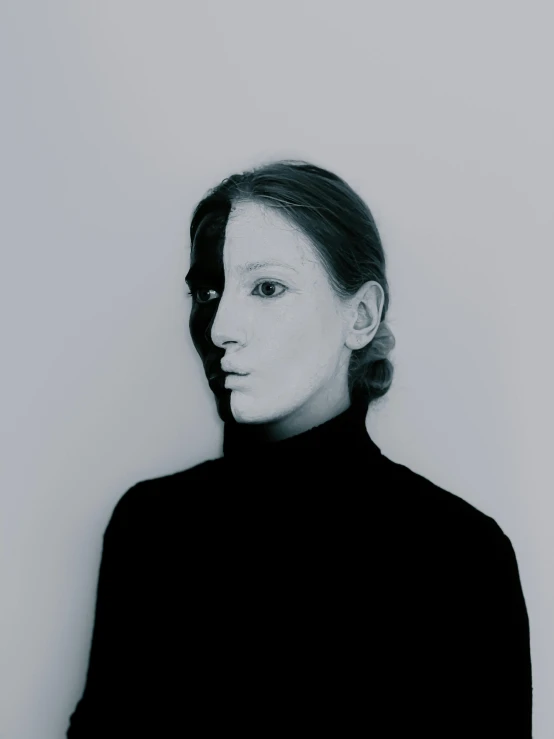 a black and white photo of a woman, inspired by Anna Füssli, integrated synthetic android, wearing turtleneck, clear symmetrical face, taken in the late 2010s