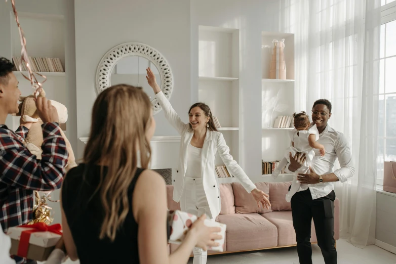 a group of people standing around a living room, dancing elegantly over you, connection rituals, corporate boss, kids playing