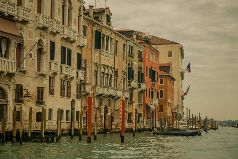 a row of buildings next to a body of water, inspired by Canaletto, pexels contest winner, renaissance, muted colours 8 k, square, venice biennale, slide show