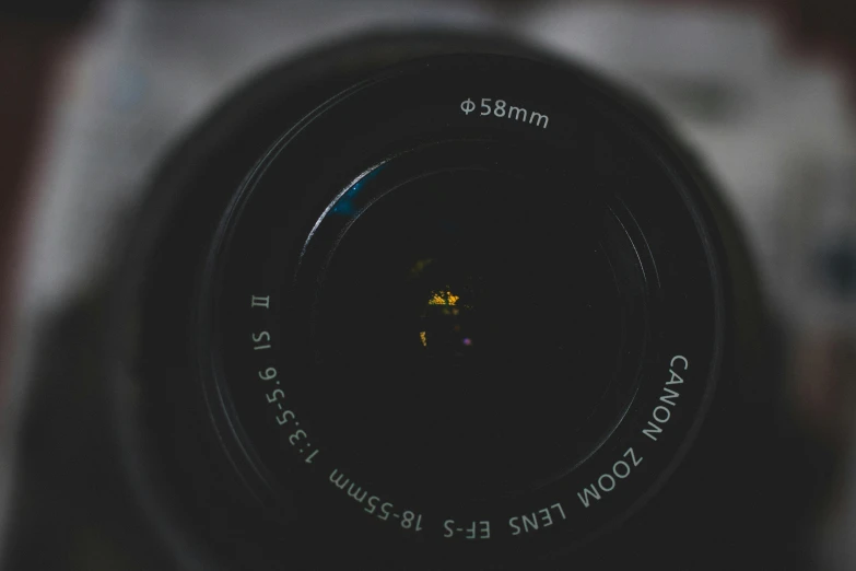 a close up of a camera lens on a table, pexels contest winner, canon dslr, looking up at camera, low quality photograph, all looking at camera