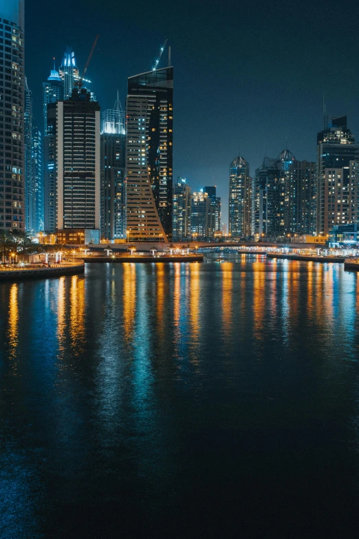 a large body of water surrounded by tall buildings, pexels contest winner, arabian night, cinematic 8k uhd, 8 k detail, waterways