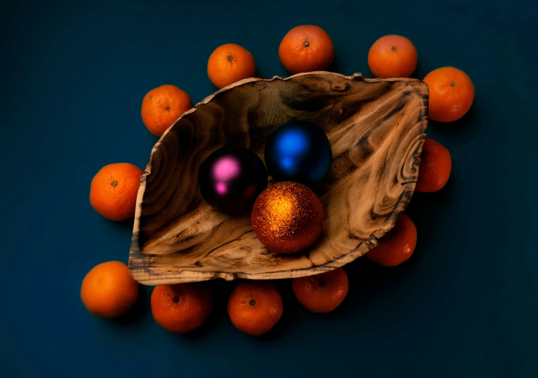 a wooden bowl filled with oranges and ornaments, by Chris Rallis, pexels contest winner, orange to blue gradient, cinema 4d multi-pass ray traced, vibrant dark mood, multi - coloured