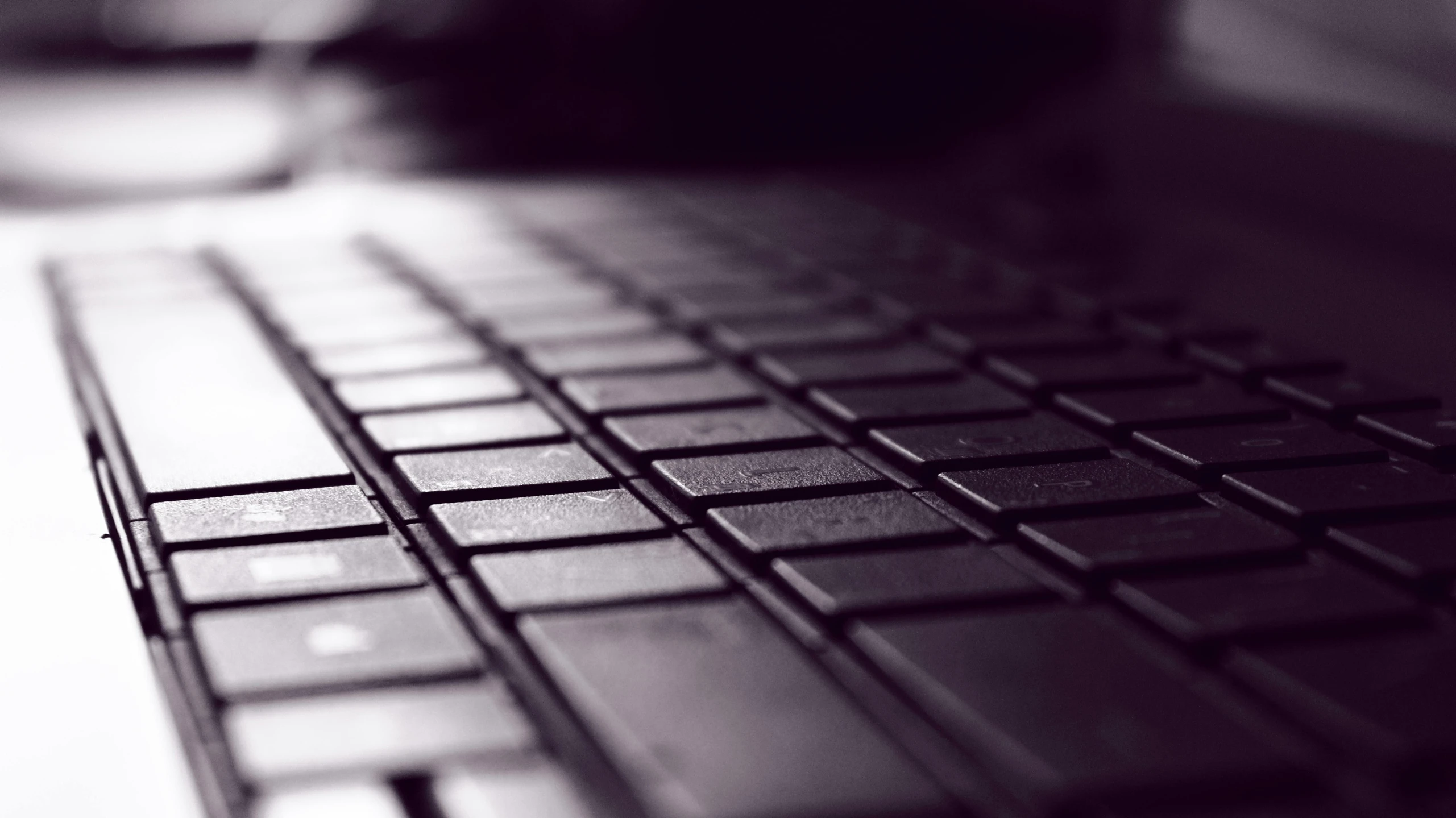 a black and white photo of a keyboard, a macro photograph, by Byron Galvez, pexels, computer art, purple, floor texture, laptop, square lines