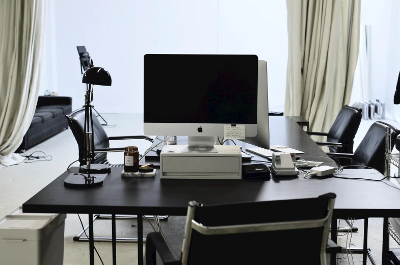 a computer sitting on top of a wooden desk, inspired by Marina Abramović, studio room, luxury equipment, dieter rams, overview
