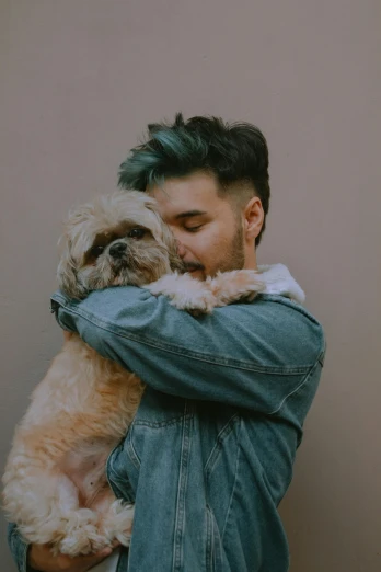 a man holding a dog in his arms, a colorized photo, trending on pexels, zayn malik, moody neutral hipster tones, hugs, ilustration