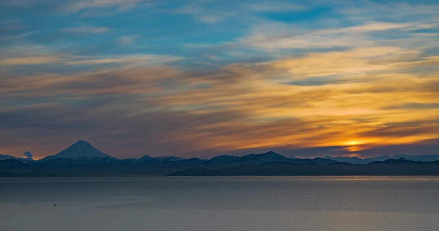 a large body of water with mountains in the background, unsplash contest winner, romanticism, evening sky, lake baikal in the background, central california, taken with canon 5d mk4