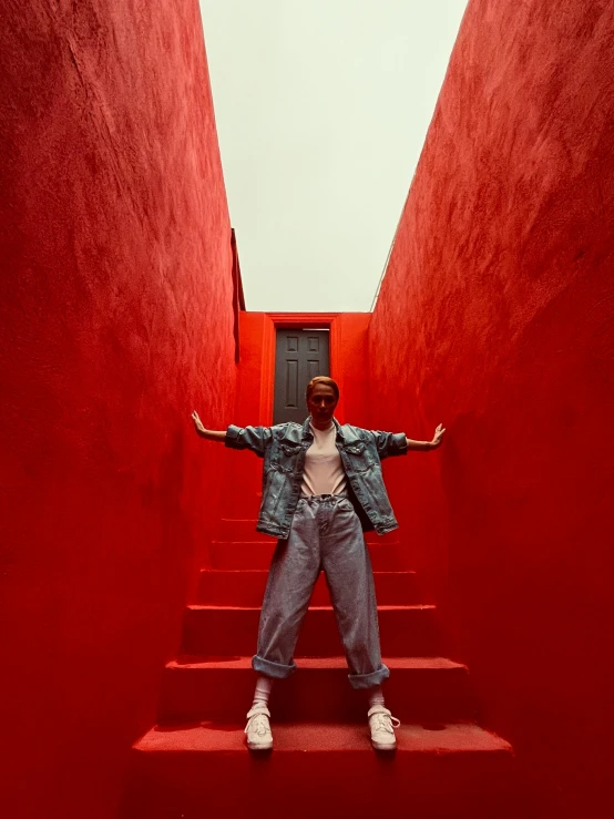 a person that is standing on some stairs, bright red, posing for a picture, bella poarch, shot on red camera