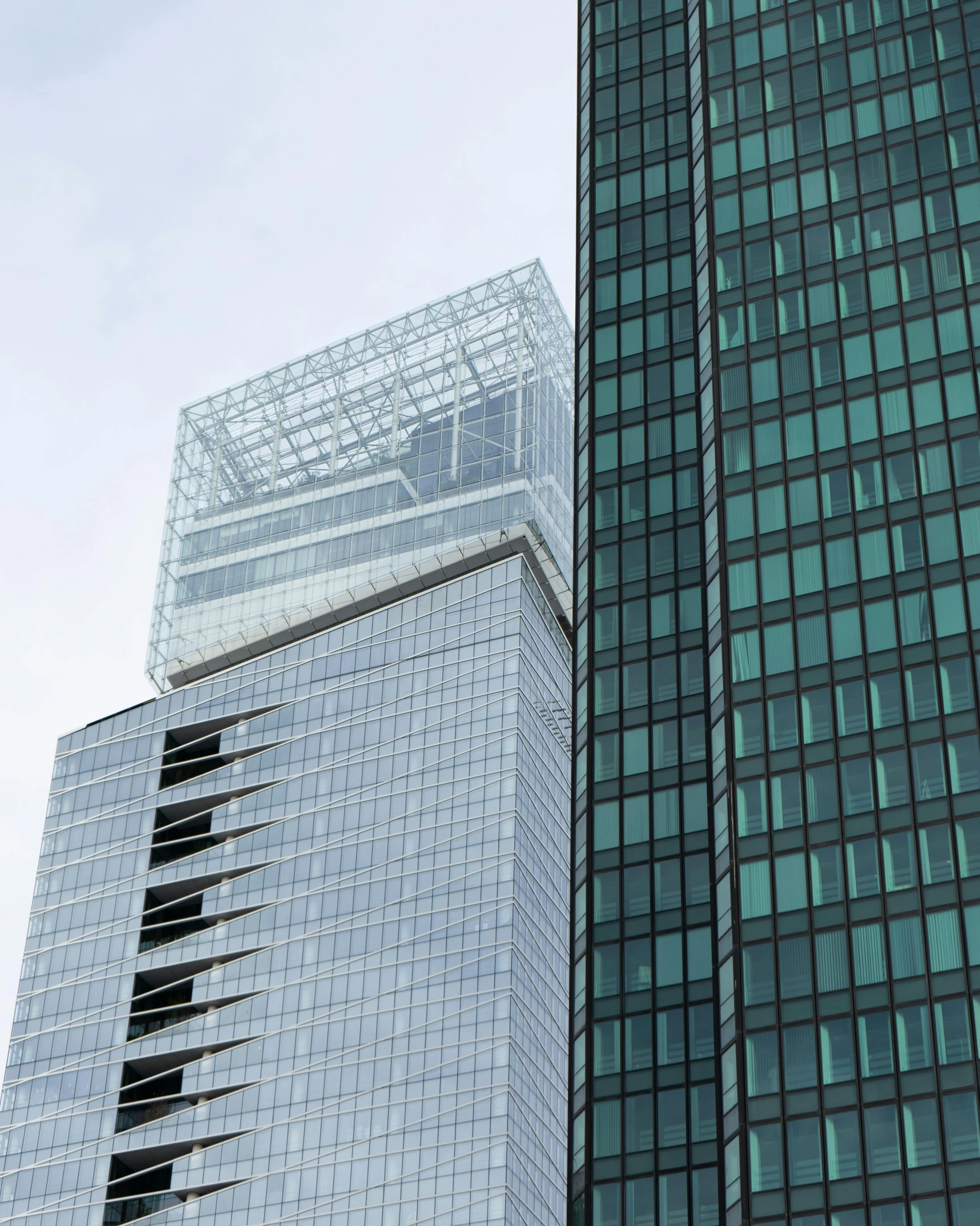 a couple of tall buildings next to each other, inspired by David Chipperfield, unsplash, lots of glass details, 2000s photo, fan favorite, square