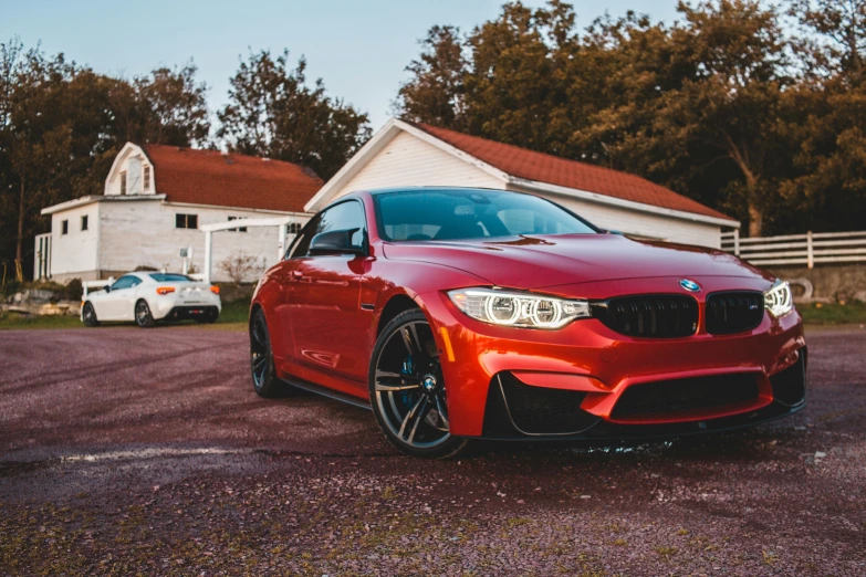 a red car parked in front of a white house, pexels contest winner, bmw m1, avatar image, brown, 🦩🪐🐞👩🏻🦳