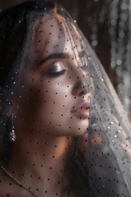 a close up of a woman wearing a veil, inspired by Hedi Xandt, trending on pexels, renaissance, wearing a sparkling dress, private moment, looking sad, brunette woman