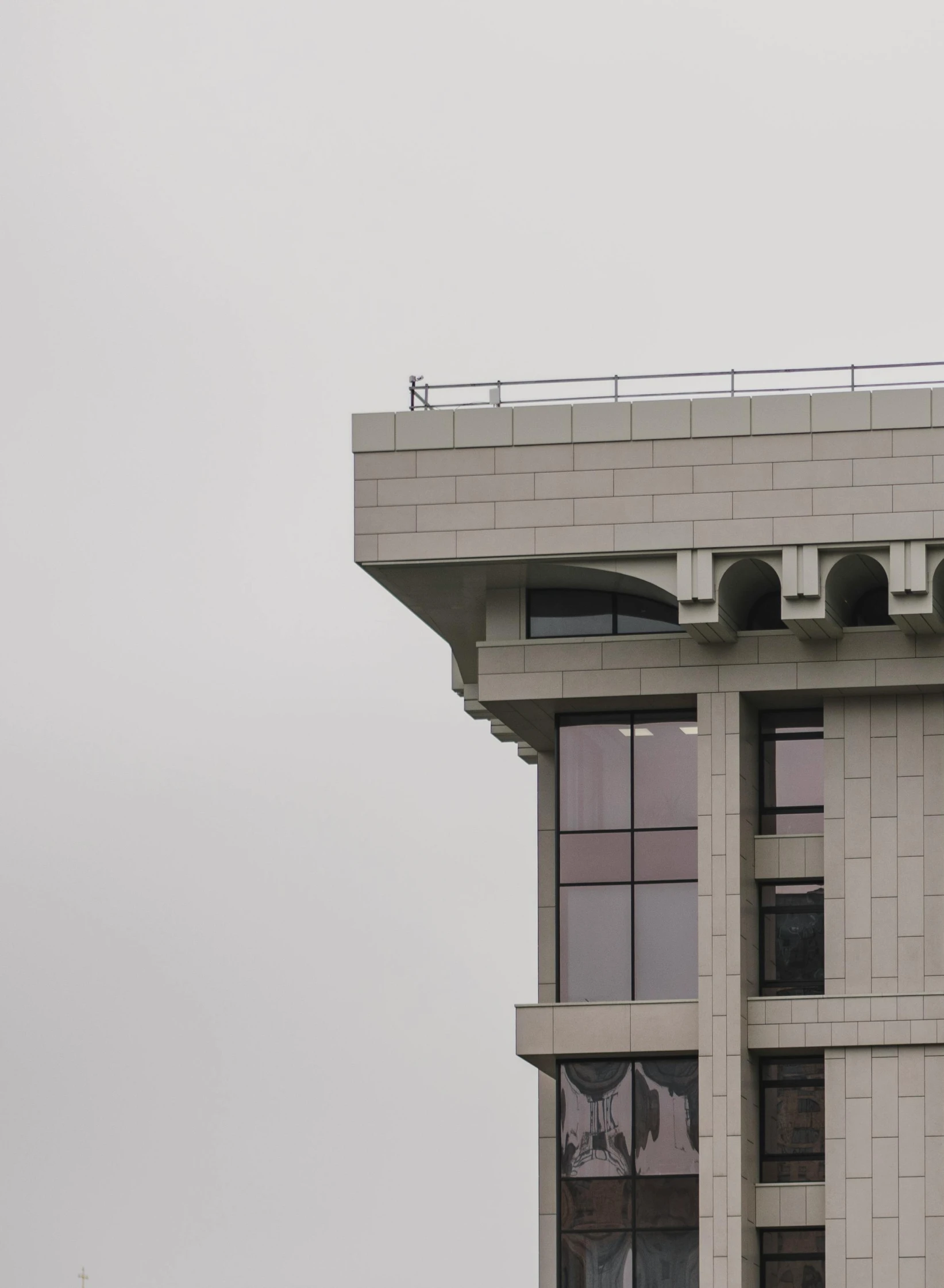 a tall building with a clock on top of it, inspired by Zhang Kechun, unsplash, brutalism, concrete balcony, washington dc, ap news photograph, looking to his left