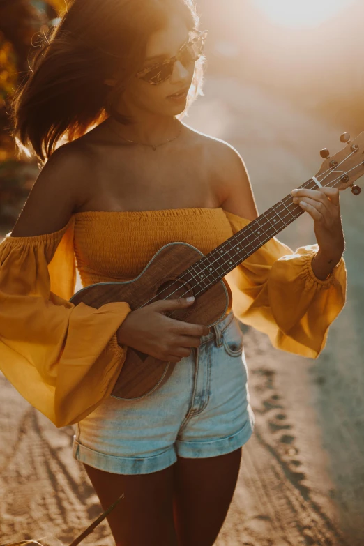 a woman standing on the side of a road holding a guitar, wearing yellow croptop, ukulele, romantic undertones, music being played