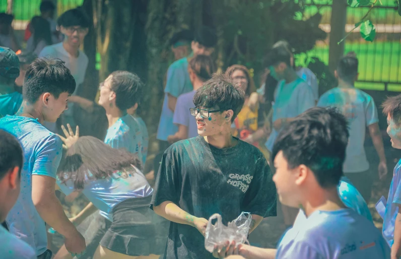 a group of young men standing next to each other, by Jang Seung-eop, pexels contest winner, process art, party in jungles, splash painting, a person at a music festival, summer camp