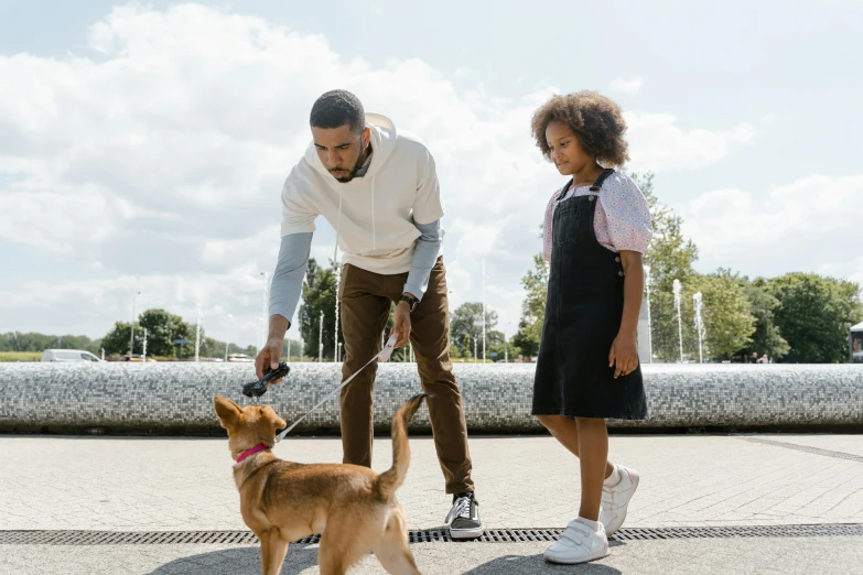 a man and a little girl playing with a dog, pexels contest winner, visual art, collar and leash, casually dressed, city park, animation