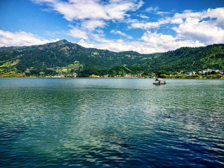 a large body of water with mountains in the background, pexels contest winner, sumatraism, uttarakhand, thumbnail, sunny summer day, fishing