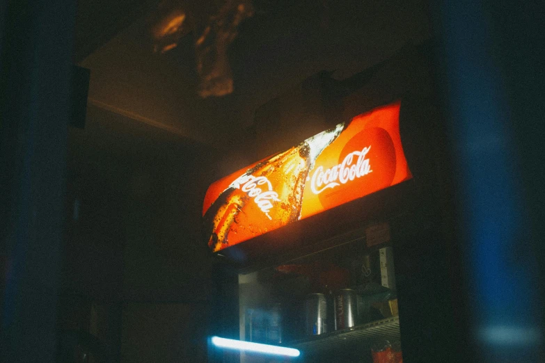 a coca cola machine lit up at night, inspired by Elsa Bleda, pexels contest winner, light entering through a blind, commercial banner, orange light, shot from below