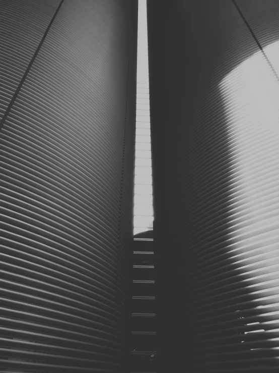 a black and white photo of two silos, unsplash, postminimalism, soft light through blinds, square lines, crisp lines and color, stairway to heaven